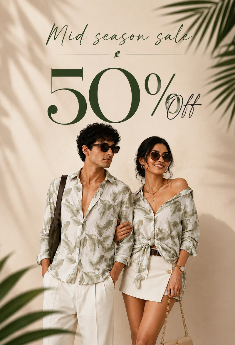 A man and a woman wearing matching light green and white tropical print button-down shirts pose together against a beige background with palm leaf shadows. Large text reads 'Mid season sale 50% Off'.